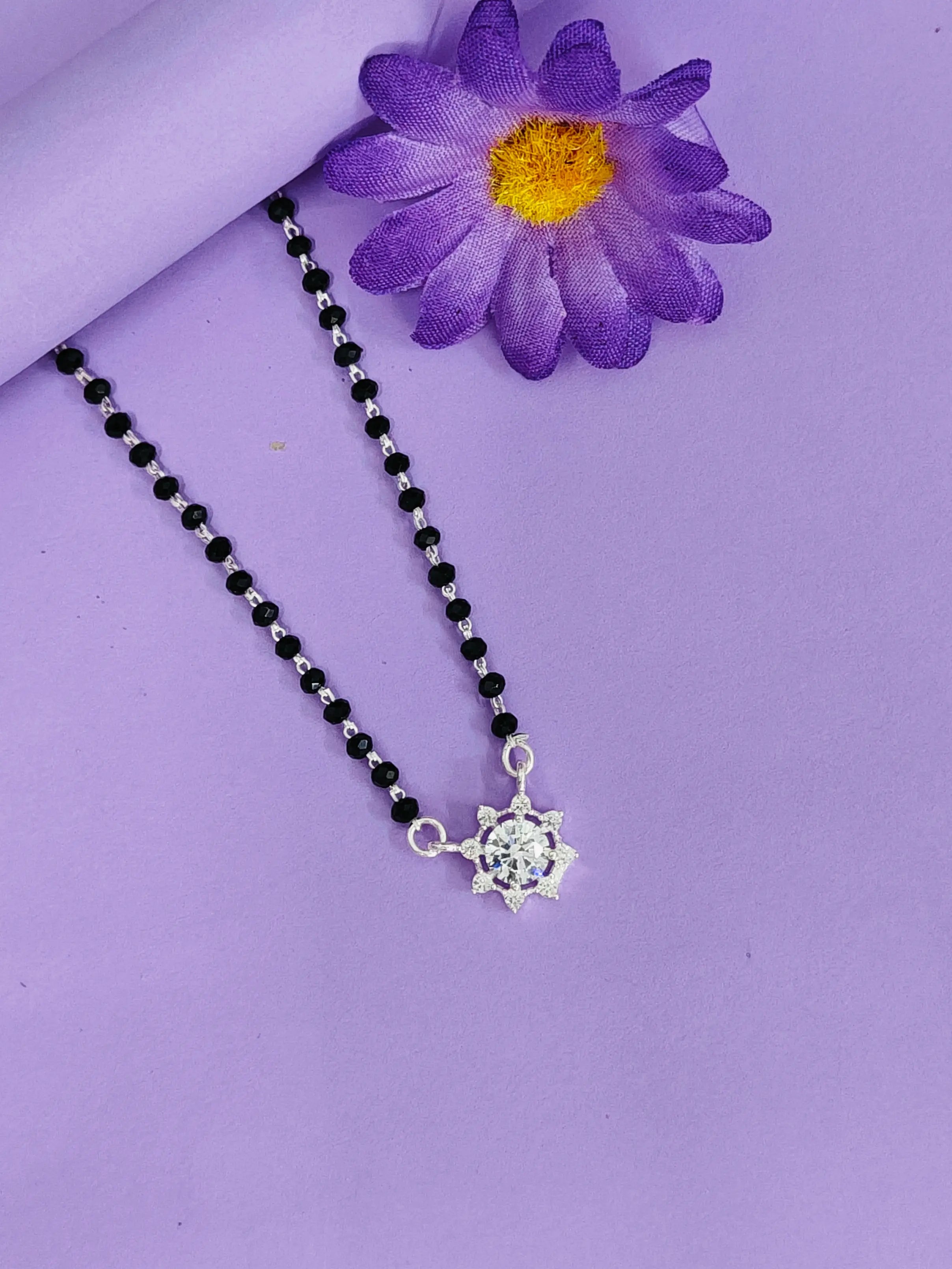 Necklace with a turtle pendant on a purple background