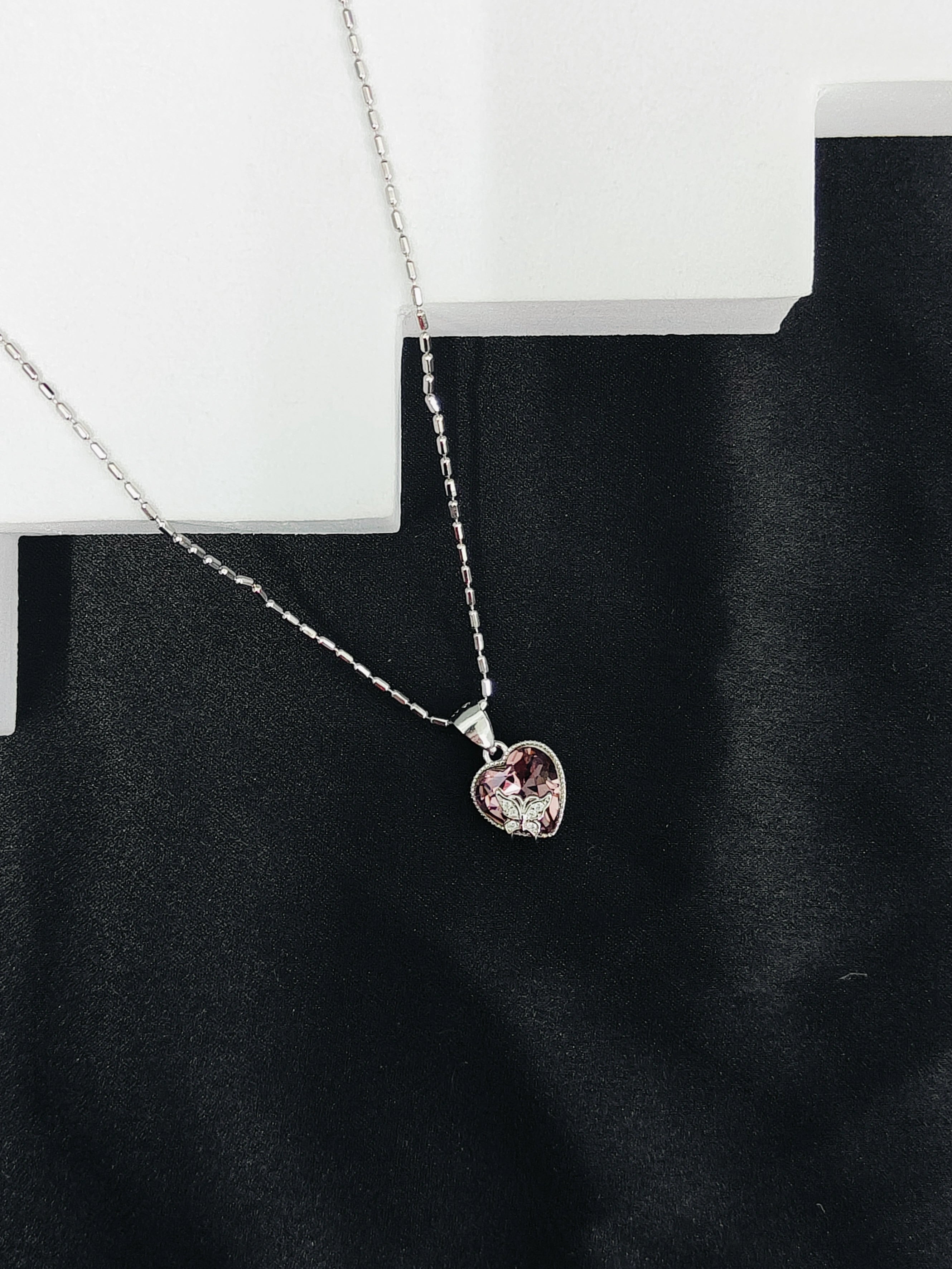 Necklace with a pendant on a black background