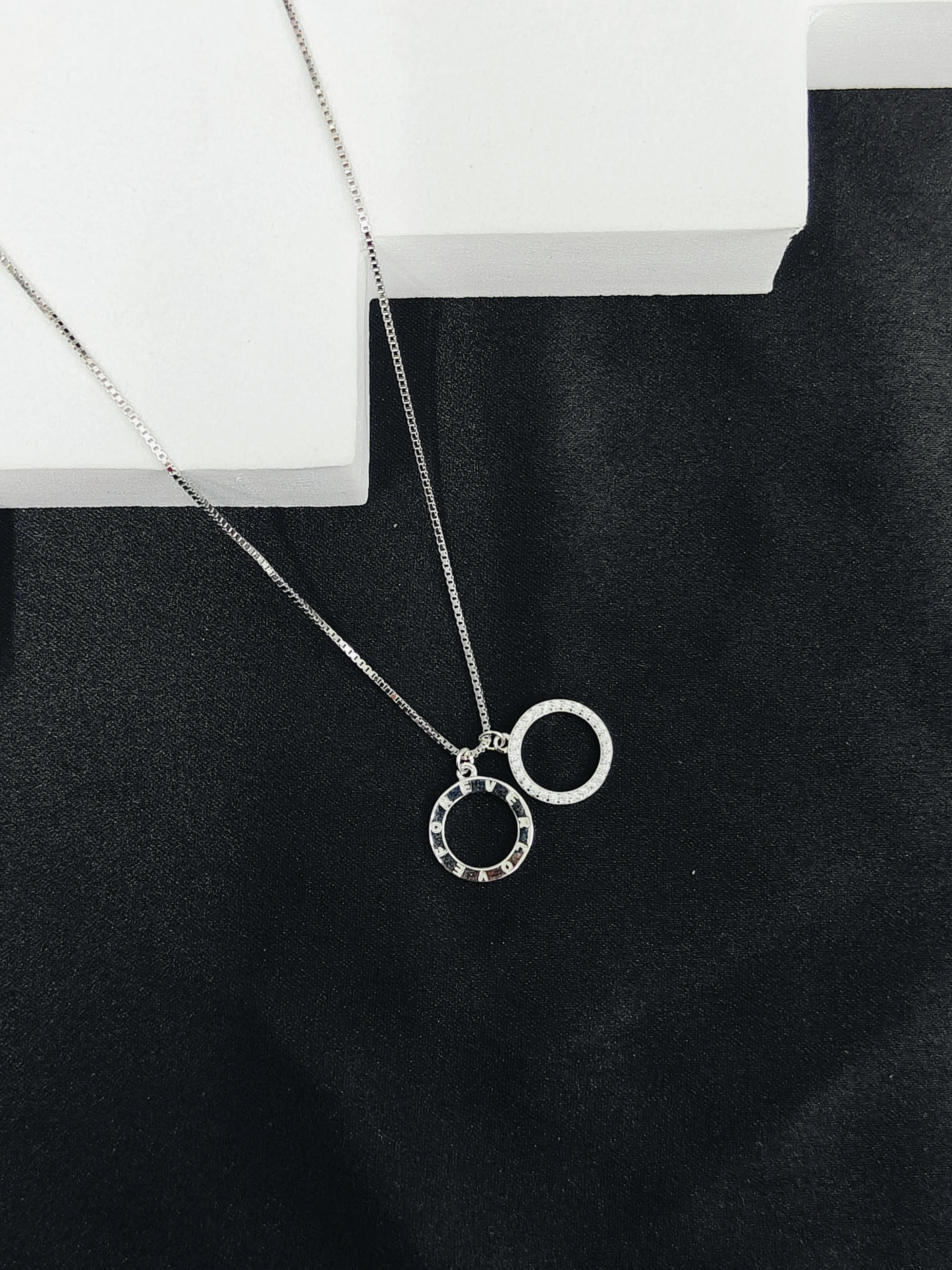 Necklace with a unique pendant on a black surface
