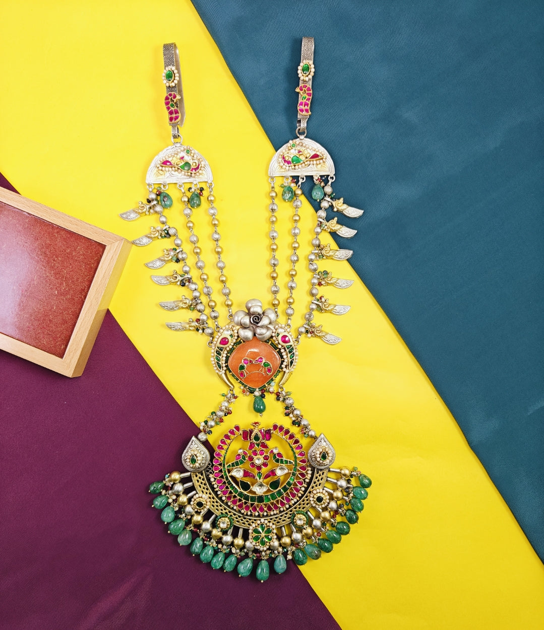 Decorative necklace with pendants on a colorful background
